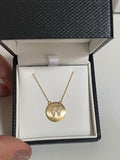 Diamond letter set in 14k matte gold disk necklace