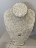 Diamond letter set in 14k matte gold disk necklace