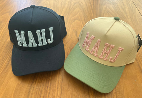 Mahj embroidered baseball caps available in Navy and Cream