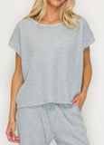 Cozy waffle knit short sleeve top available in navy and h. Grey