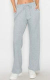 Cozy waffle knit wide leg drawstring pants available in navy and h. Grey