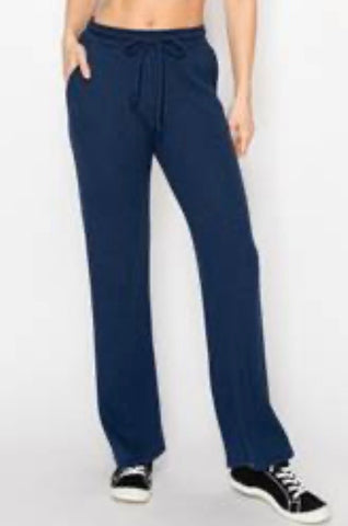 Cozy waffle knit wide leg drawstring pants available in navy and h. Grey