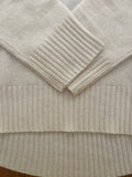 Cashmere crew neck with curved hem and chunky rib details *available in cream, black, and h. grey