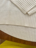 Cashmere crew neck with curved hem and chunky rib details *available in cream, black, and h. grey
