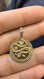 14k yellow gold snake charm with diamond accent and carved details