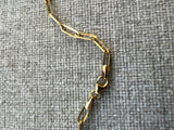 14K yellow gold paperclip necklace with lock charm