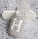 Cozy Check slippers available in taupe and black